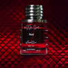 Perfume bottle labeled 'esse sport Red' on a red textured background