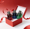 Three perfume bottles in red, blue, and green with a red box on a white background.